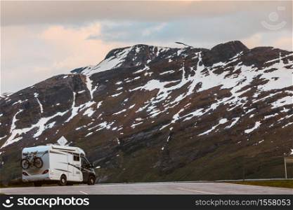 Tourism vacation and travel. Camper van motorhome in norwegian mountains. Camper car in norwegian mountains