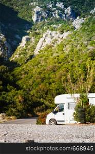 Tourism vacation and travel. Camper van motorhome on nature in Greece. Camper car motorhome on nature
