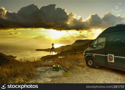 Tourism vacation and travel. Camper van on nature at sunrise over sea surface, Greece Peloponnese Mani Peninsula.. Camper car on nature at sunrise. Travel