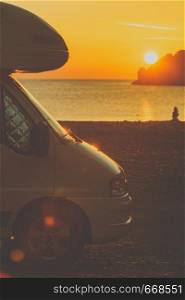 Tourism vacation and travel. Camper van on nature at sunrise over sea surface, Greece Peloponnese.. Camper car on nature at sunrise. Travel