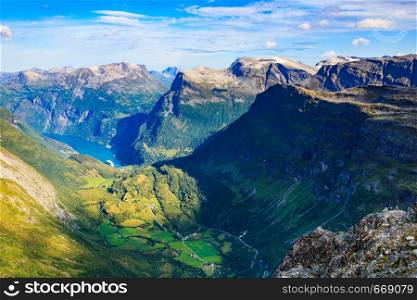 Tourism vacation and travel. Fantastic view on fjord Geirangerfjord and mountains landscape from Dalsnibba viewpoint, Norway. Geirangerfjord from Dalsnibba viewpoint, Norway