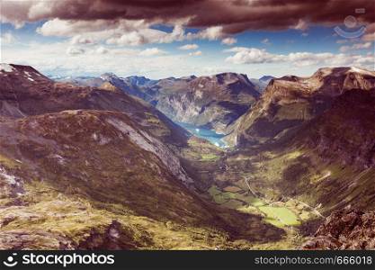 Tourism vacation and travel. Fantastic view on Geirangerfjord and mountains landscape from Dalsnibba viewpoint, Geiranger Skywalk platform, Norway.. Geirangerfjord from Dalsnibba viewpoint, Norway