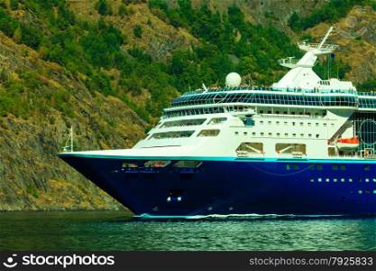 Tourism vacation and travel. Mountains and cruise ship on fjord Sognefjord in Norway, Scandinavia.
