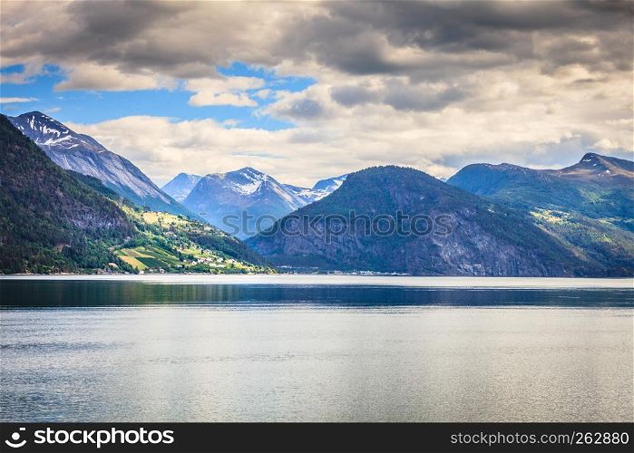 Tourism vacation and travel. Mountains landscape and fjord in Norway Scandinavia Europe. Norddalsfjorden as seen from ferry. Beautiful nature. Mountains landscape and fjord in Norway
