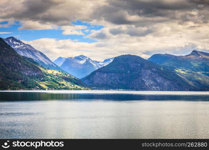 Tourism vacation and travel. Mountains landscape and fjord in Norway Scandinavia Europe. Norddalsfjorden as seen from ferry. Beautiful nature. Mountains landscape and fjord in Norway