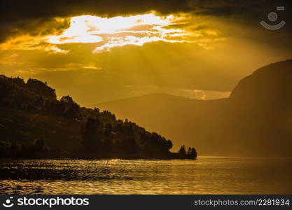 Tourism vacation and travel. Red sunset over fjords mountains landscape, Sogn og Fjordane county, Norway Scandinavia Europe. Beautiful nature. Red sunset over sea fjord Norway