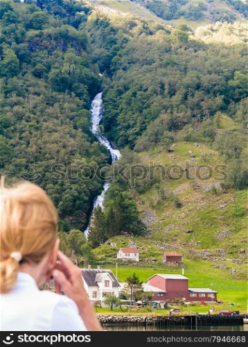 Tourism vacation and travel. Woman tourist boat trip on fjord Sognefjord in Norway, Scandinavia.