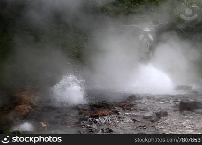 Tourist and geyser on the river in Pongduet national park, Thailand