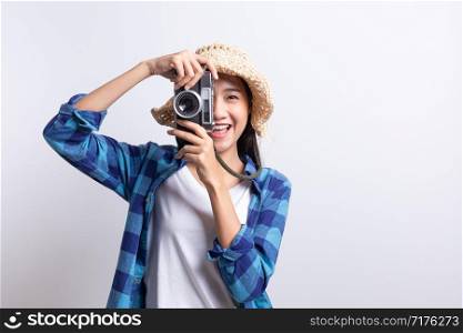 tourist Beautiful of Asian woman holding a film camera and smiling isolated on white background, Asia girl wear Plaid shirt and wear Straw hat, Summer concept