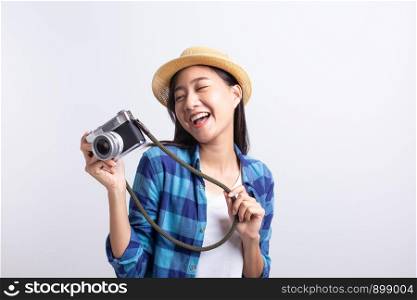tourist Beautiful of Asian woman holding a film camera and smiling isolated on white background, Asia girl wear Plaid shirt and wear Straw hat, Summer concept