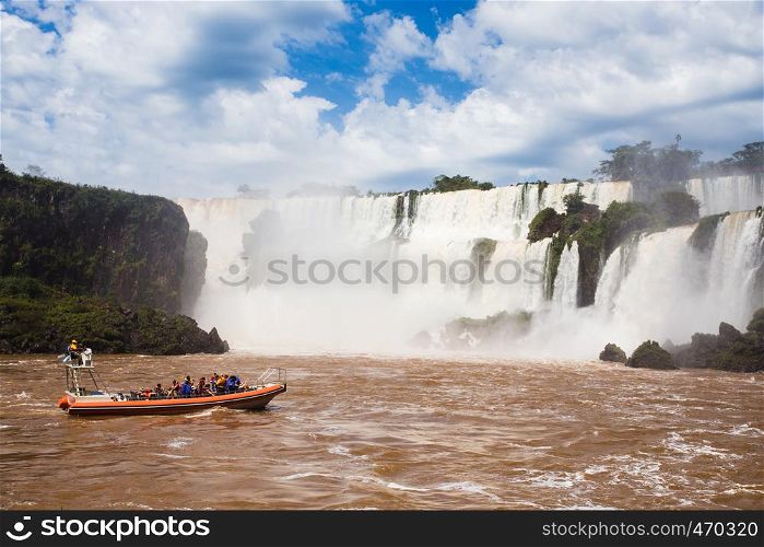 tourist boat at Iguazu falls cascades at Argentina