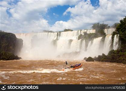 tourist boat at Iguazu falls cascades at Argentina