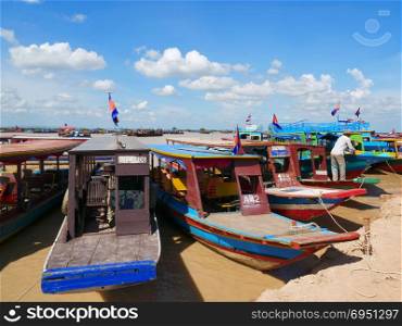 Tourist boats are waiting to welcome visitors to Tonle sap Lake, Cambodia.