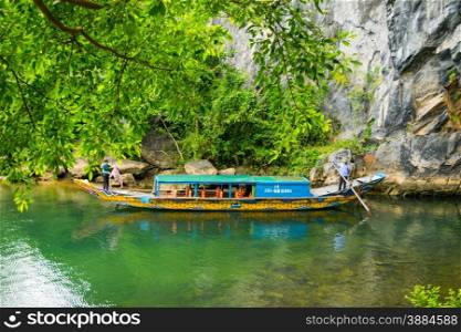 Tourist boats, the mouth of Phong Nha cave with underground river, Phong Nha-Ke Bang National Park, Vietnam