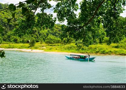 Tourist boats, the mouth of Phong Nha cave with underground river, Phong Nha-Ke Bang National Park, Vietnam