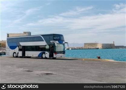 Tourist bus on the pier in the sea port of Heraklion. Greece. Crete.. Tourist bus on the dock.
