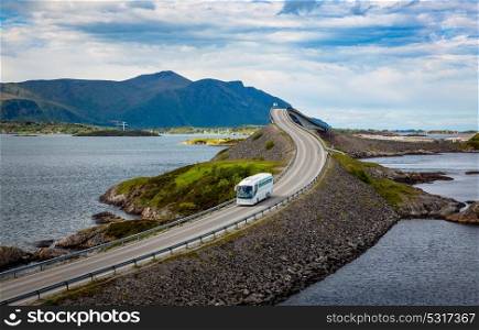 "Tourist bus traveling on the road in Norway. Atlantic Ocean Road or the Atlantic Road (Atlanterhavsveien) been awarded the title as "Norwegian Construction of the Century"."