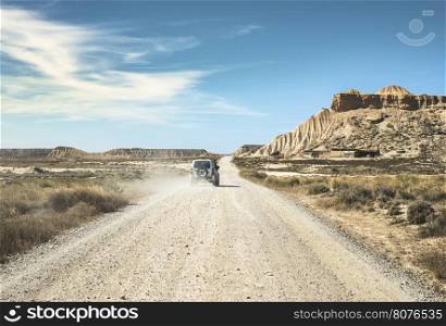 Tourist car and vintage dirt road
