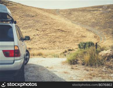 Tourist car and vintage dirt road