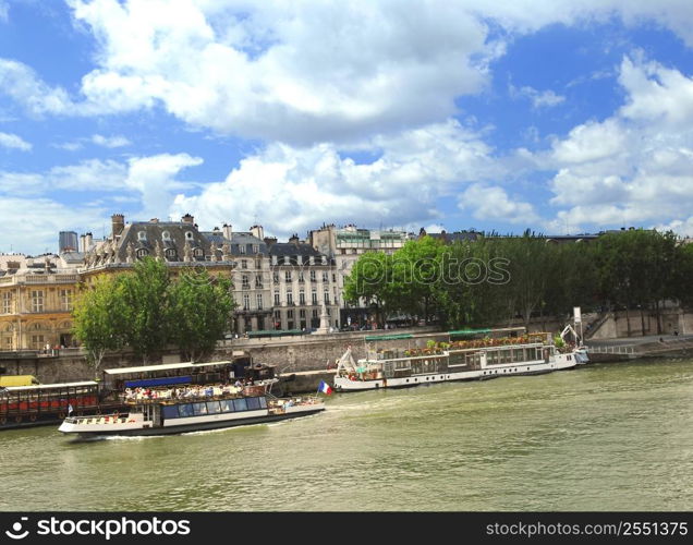 Tourist cruise boats on river Seine in Paris, France.