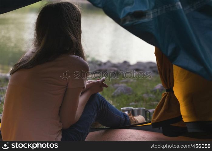 tourist girl lying in a tent, norway