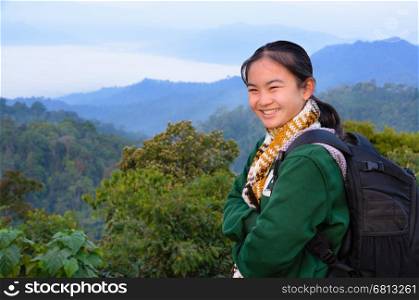 Tourist girl on the mountain in the morning at Panoen Thung scenic point Kaeng Krachan National Park Phetchaburi province Thailand