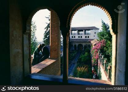 Tourist in a palace, Alhambra, Granada, Andalusia, Spain