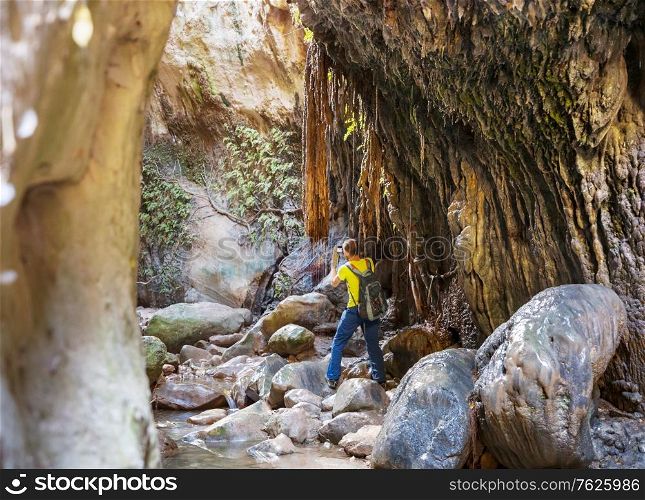 Tourist in Avakas Gorge. Paphos District, Cyprus. Famous small canyon in Sounh Cyprus.