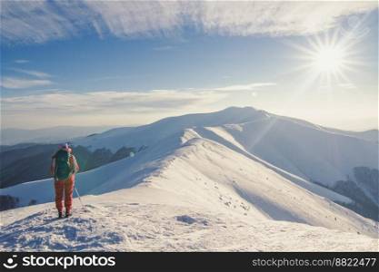 Tourist in Carpathian mountains landscape photo. Beautiful nature scenery photography with blue sky on background. Idyllic scene. High quality picture for wallpaper, travel blog, magazine, article. Tourist in Carpathian mountains landscape photo