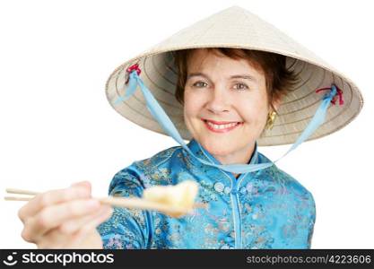 Tourist in Chinatown holding a chinese dumpling toward the camera - offering a bite. Isolated on white.
