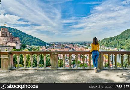 Tourist in Heidelberg town on Neckar river in Baden-Wurttemberg, Germany