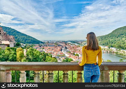 Tourist in Heidelberg town on Neckar river in Baden-Wurttemberg, Germany