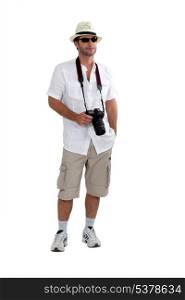 tourist in shorts with camera