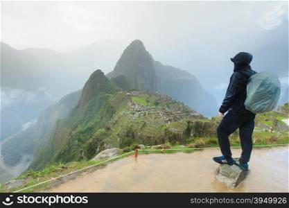 Tourist looking over Machu Picchu, Peru