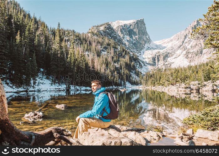Tourist near Dream Lake at autumn in Rocky Mountain National Park. Colorado, USA.