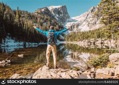Tourist near Dream Lake at autumn in Rocky Mountain National Park. Colorado, USA.