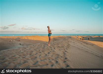 Tourist on the Maspalomas desert in Gran Canaria, Canary Islands, Spain