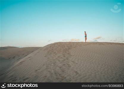 Tourist on the Maspalomas desert in Gran Canaria, Canary Islands, Spain