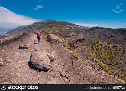 Tourist on Top of San Antonio volcanic crater in La Palma island, Canary islands, Spain.