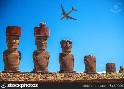 tourist plane flies over the statues of Easter Island. Easter island