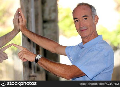 Tourist pointing at an information board