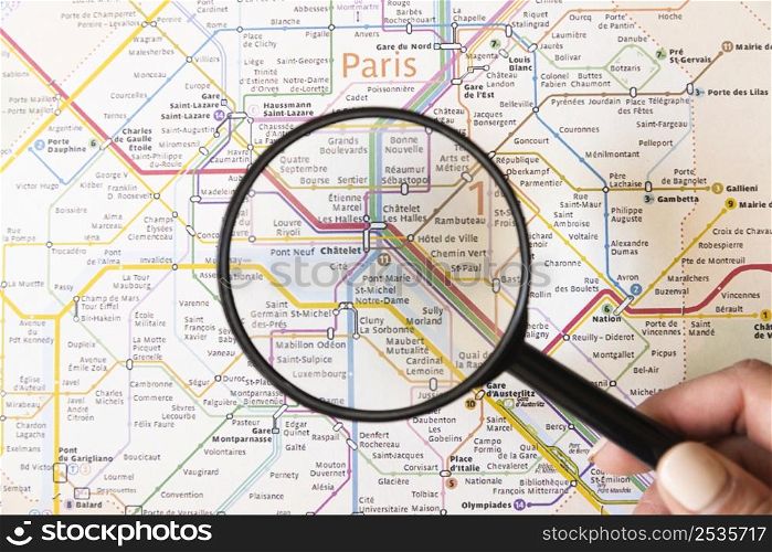 tourist showing place paris with magnifying glass