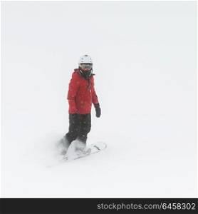 Tourist snowboarding on snowy mountain, Whistler, British Columbia, Canada