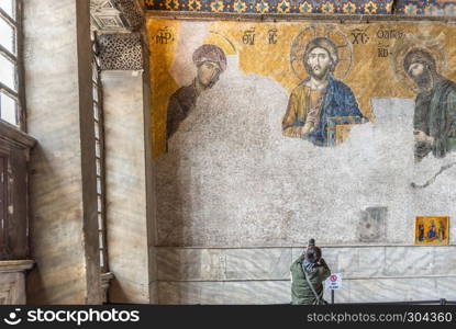 Tourist takes photo of Jesus Christ Pantocrator,Detail from deesis Byzantine mosaic in Hagia Sophia in Istanbul, Turkey,March,11 2017.. Jesus Christ Pantocrator,Detail from deesis Byzantine mosaic in Hagia Sophia