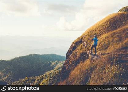 Tourist trail hiking in the forest Traveler Man Relax and crossing the mountain Traveler concept