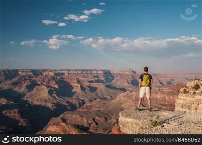 Tourist with backpack at Grand Canyon, Arizona, USA