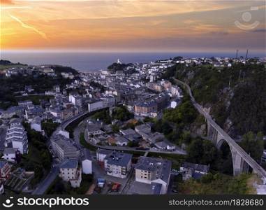 Touristic destination Luarca, Asturias, Spain, Europe. Nature urban landscape with fishing and pleasure port at sunset.