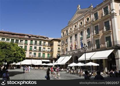 Tourists and locals alike enjoying life in Plaza Mayor, Segovia, Spain