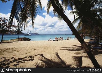 Tourists are relaxing on an exotic beach, The Grenadines