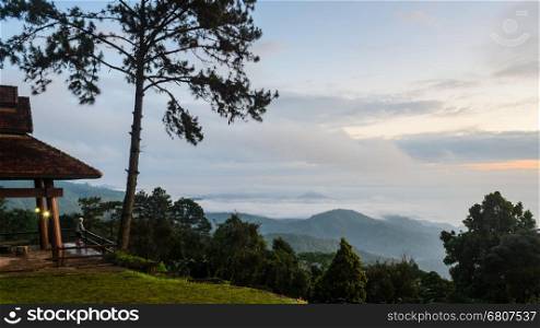 Tourists are standing views of high mountains and haze on viewpoint at Huai Nam Dang national park in Chiang Mai and Mae Hong Son, Thailand